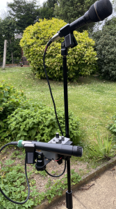 A complet busking set up with stand, Vocal mic guitar mic and battery powered audio mixer.